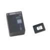Portable 9V alkaline battery charger with a separate clip/plug-in adapter nearby