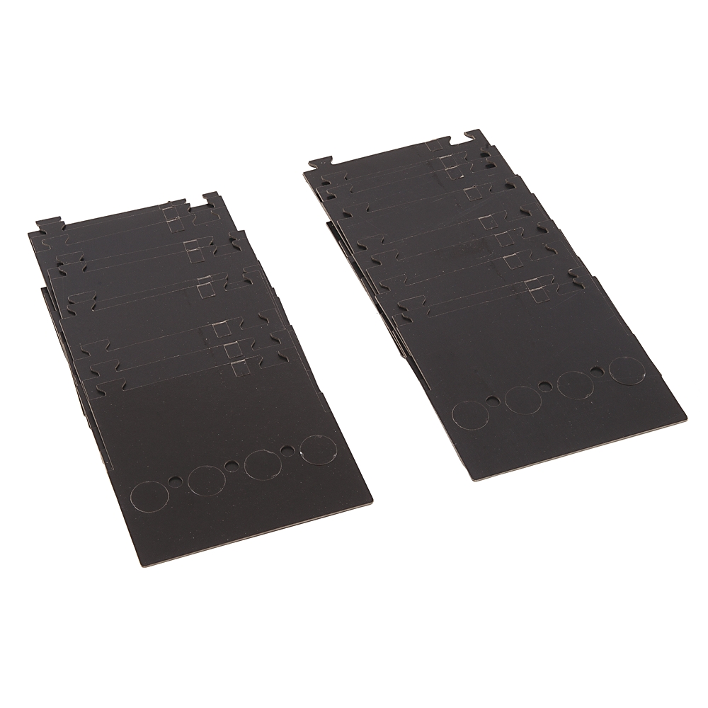 Two black plastic panels with multiple cutouts and circular depressions along the bottom edge, angled side by side on a white background.