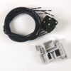 Coiled black multi-conductor cable with a small green electronic module, beside a gray plastic mounting bracket.