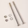 Two silver bolts with hex nuts and flat washers laid out on a light surface for hardware assembly.