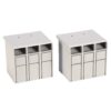 Two white modular terminal blocks with three vertical slots each, used for wiring connections on a electrical panel at a desk setup.