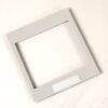 Light gray square photo frame with an empty central opening on a neutral background.