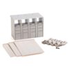 Plastic modular storage cabinet with four columns of small drawers and spare panels and screws in front of white background, product kit.