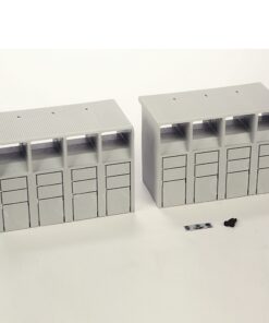Two gray modular storage units with four vertical drawer columns on a white surface, plus small scale items nearby.