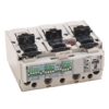 Three-pole electrical contactor with three black handles and a red test/reset button, viewed at an angle from the side, showing terminal blocks on top and a green-pin indicator panel on the front.