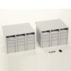 Two identical gray modular storage cabinets with top open slots and multiple drawers, on a white surface.