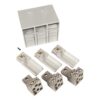 Three metal terminal blocks with screw terminals and three white plastic connector modules arranged around a gray modular enclosure, plus a small screw