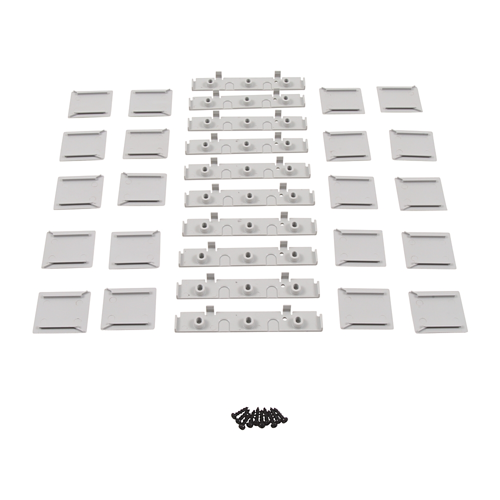 Kit of white plastic mounting brackets with a small bundle of black screws laid out in rows.