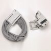 Coiled gray electrical cable with a rectangular connector on the left and a separate gray plug-in module with five pins on the right.