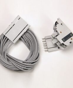Coiled gray electrical cable with a rectangular connector on the left and a separate gray plug-in module with five pins on the right.