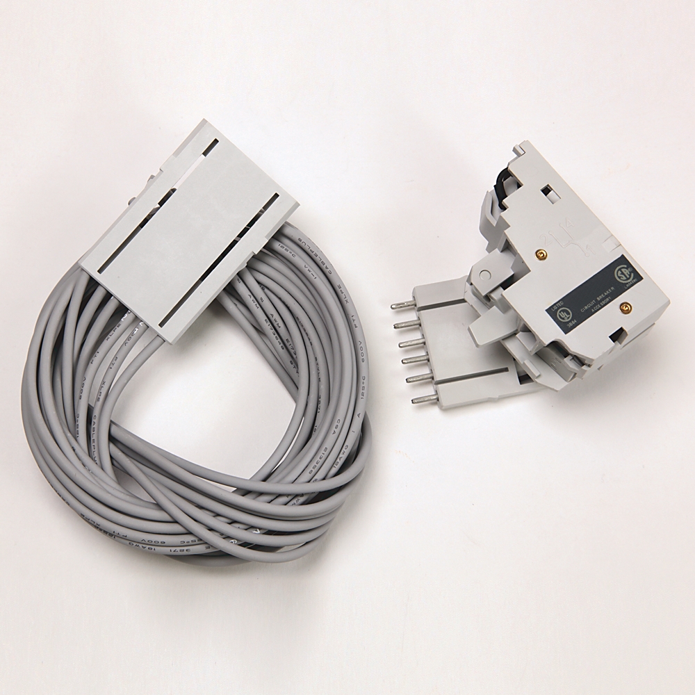 Coiled gray electrical cable with a rectangular connector on the left and a separate gray plug-in module with five pins on the right.
