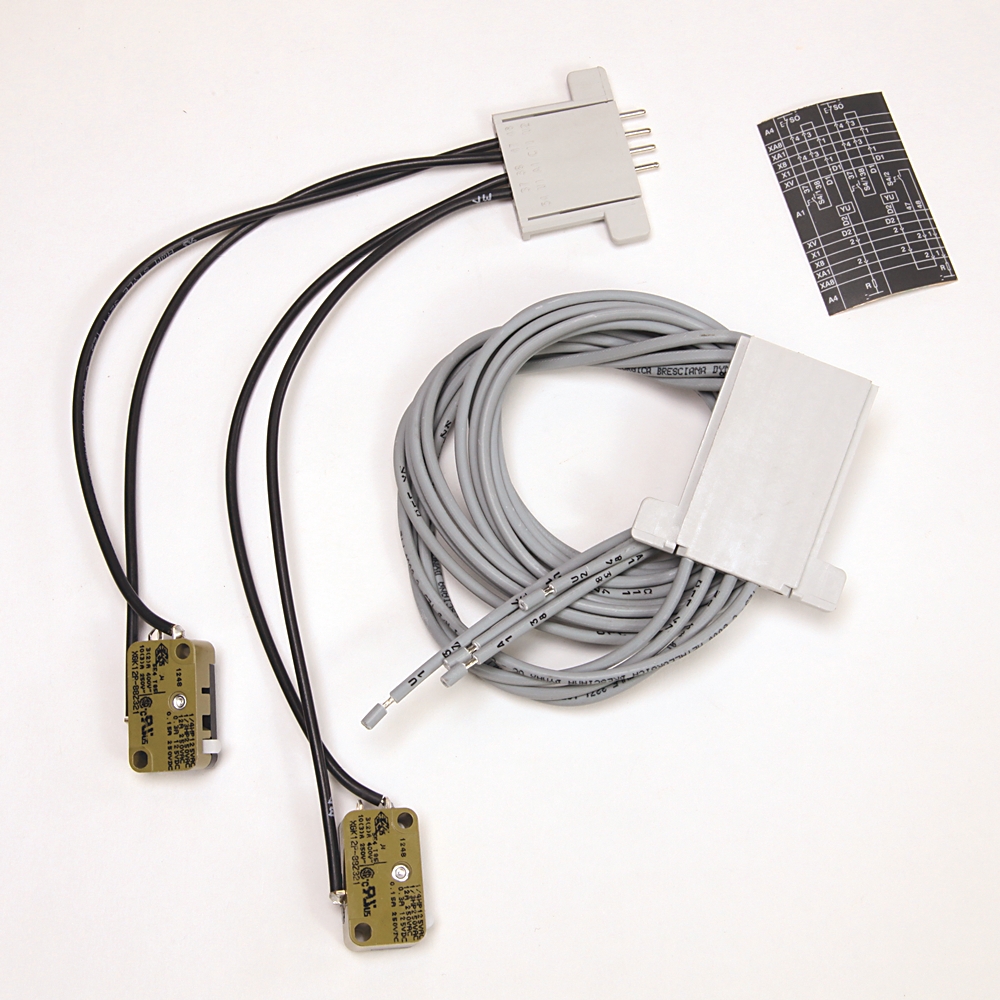Two adhesive medical electrodes with attached wires, plus a white interface plug and a coiled gray data cable for patient monitoring.