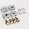 Four gray plastic mounting blocks with brass threaded inserts, arranged with four screws and four washers on a white background for hardware assembly.