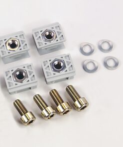 Four gray plastic mounting blocks with brass threaded inserts, arranged with four screws and four washers on a white background for hardware assembly.