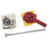 Three electrical safety components: a white control box with a large gray rotary switch and wiring terminals, a yellow safety switch with red operator handle, and a metal mounting rod.