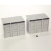 Two gray modular storage lockers with three doors each, placed on a white background; a small black screw lies in front.