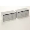 Two gray modular storage lockers (model) with vented tops on a white surface.