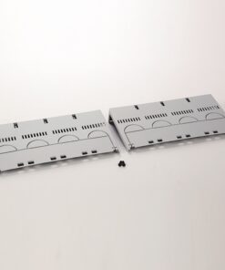 Two gray panels with ventilation slots and curved cutouts lie side by side on a white surface, with four small black screws between them.
