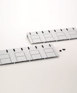 Two gray modular plastic panels with four raised rectangular sections and vertical vent slots, with screws nearby on a white surface.