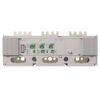 Industrial electrical drive module with several green terminal blocks on a gray metal chassis and cooling fins on both ends. Represents an I/O wiring block for a drive system, with mounting holes and circular cutouts below the panel.