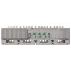 Back view of a gray industrial control module with multiple green terminal blocks and connectors on a metal rack chassis