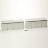 Pair of gray modular storage cabinets with multiple front panels on a white background; small screws sit between them.