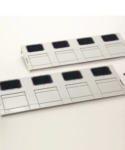 Two white 4-slot drive bay panels with square openings on a white background, with a few screws nearby.