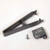 Black plastic U-shaped lever tool with a curved grip, plus a small screw and a gray CB trip unit labeled 'In=1200A' and UL Listed logo.