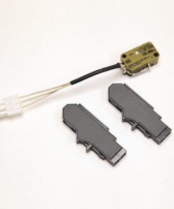 Yellow electronic module with black-wrapped wires leading to a white connector, accompanied by two dark gray plastic housings on a white background (likely a small laser/optical sensor component and related parts).