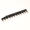 Black plastic pin-header strip with multiple copper pins for PCB connections.