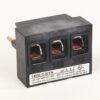 Three-pole terminal block with copper conductors visible in three rectangular openings, black housing and label 140M-C-WTN