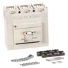 A white circuit breaker with assorted hardware parts like screws, washers, nuts, and mounting brackets laid out below.