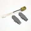 Yellow sensor module with a black cable and a white 4‑pin connector, beside two gray plastic housings on a white background.