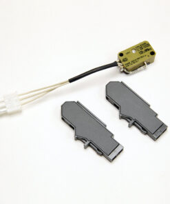 Yellow sensor module with a black cable and a white 4‑pin connector, beside two gray plastic housings on a white background.