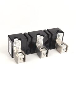 Three black electrical circuit breaker modules with silver terminal lugs lined up on a white background.