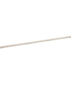 Long white ruler with orange measurement marks lying diagonally across the image.