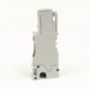 Gray plastic industrial electrical module seen from the side, with a bottom mounting notch, likely a plug-in relay/block.