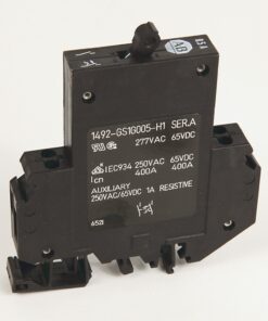 Black high‑power electrical relay module with front label showing 277VAC and 65VDC ratings and mounting holes on the body.