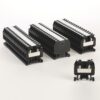 Three large black terminal blocks with rows of screw terminals and metal clamps, arranged on a white background, plus a smaller adjacent block. Intended for PCB or DIN rail terminations.