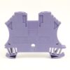 Back view of a purple plastic terminal block connector for industrial wiring, with mounting holes and feet visible