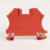 Orange plastic electrical terminal block viewed from the back, with wire-clamp slots and mounting feet for wiring connections.