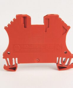 Orange plastic electrical terminal block viewed from the back, with wire-clamp slots and mounting feet for wiring connections.