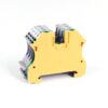 Yellow modular terminal block connector used for wiring electrical circuits. (close-up)