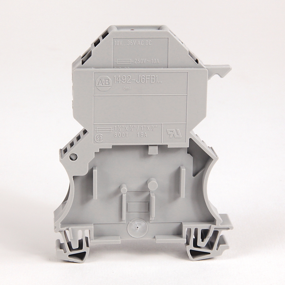 Back view of a gray modular electrical terminal block with mounting base and clamps.