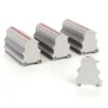 Row of gray multi-terminal blocks with red indicator caps arranged on a white surface, used in electrical wiring.