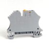 Grey DIN-rail mounted terminal block module with orange top actuator, side view on white background
