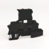 Black plastic electrical connector housing with mounting slots and wiring channels.