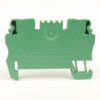 Green modular electrical terminal block viewed from the back, with label showing ratings (550V, 1.5mm²) and connectors for wires on top and bottom margins.