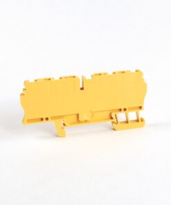 Yellow plastic terminal block connector part on a white background, viewed from the side.