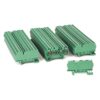 Green modular terminal blocks arranged in rows, used for electrical wiring connections.